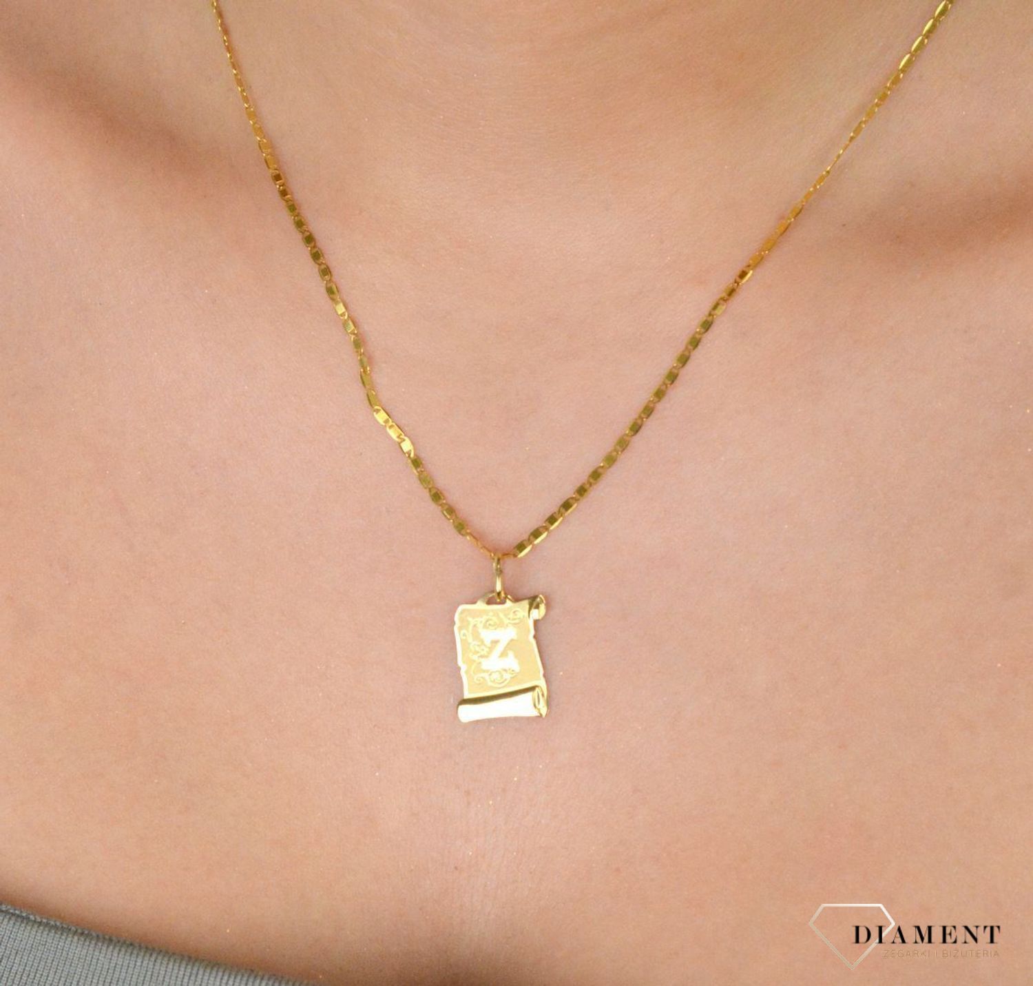 Złota zawieszka damska literka Z na papirusie ZA 2411Z 585 Piękny, złoty wisiorek o ciekawym wzorze wykonany ze złota. Zawieszka o formie papirusu czyli starodawnego pergaminu 1.jpg